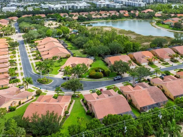 Aerial perspective of suburban area featuring a large body of water