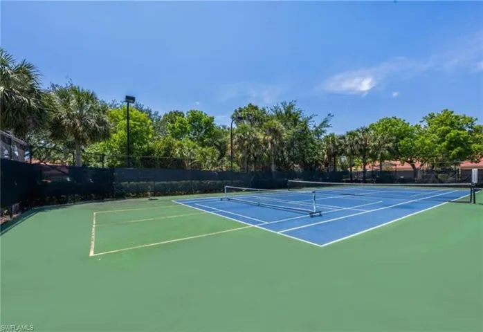 View of tennis court featuring community basketball court