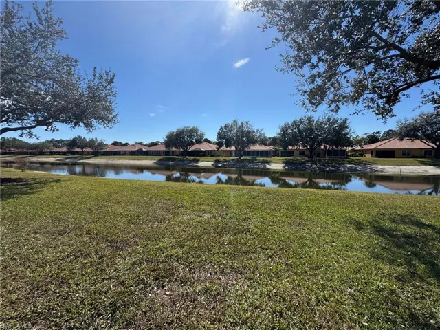 View of yard with a water view