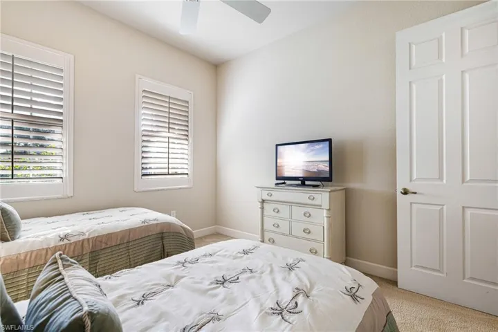 Guest Room with Plantation Shutters and spacious closet with custom built-in closet system