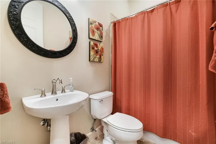 Bathroom with Pedestal sink, tub/shower combo
