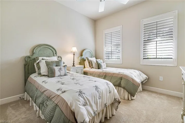 Guest Room with Plantation Shutters and spacious closet with custom built-in closet system