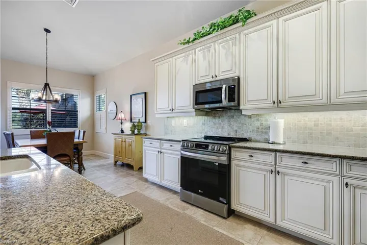 Kitchen is open to large Dining Area (Table sits 8 with table leaf)
