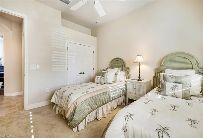 Guest Room with Plantation Shutters and spacious closet with custom built-in closet system