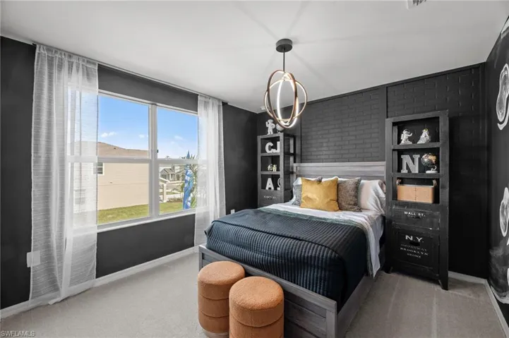Bedroom with carpet flooring and baseboards
