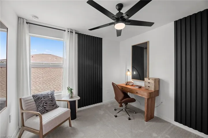 Office featuring ceiling fan, carpet flooring, and baseboards