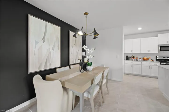 Dining space featuring baseboards, recessed lighting, and light tile patterned flooring