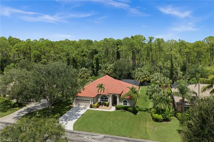 Private setting, lush tropical landscaping, and spacious homesite