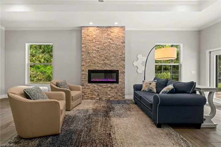 Versatile bonus room featuring a striking stone fireplace—ideal for a home office, media room, fitness studio, or guest space.