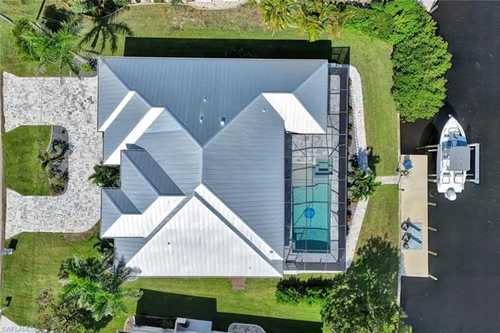 View of subject property with a pool area