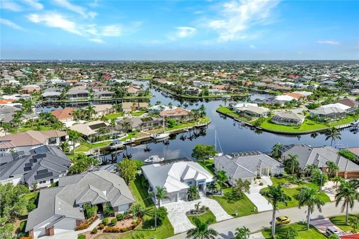 Aerial view of residential area featuring a large body of water