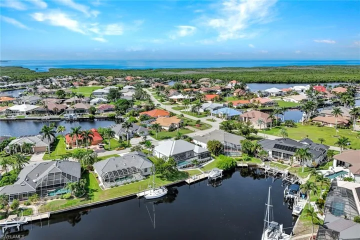 Aerial view of residential area with a nearby body of water