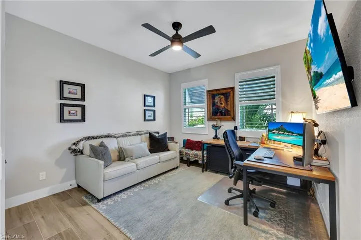 Office featuring wood finished floors and a ceiling fan