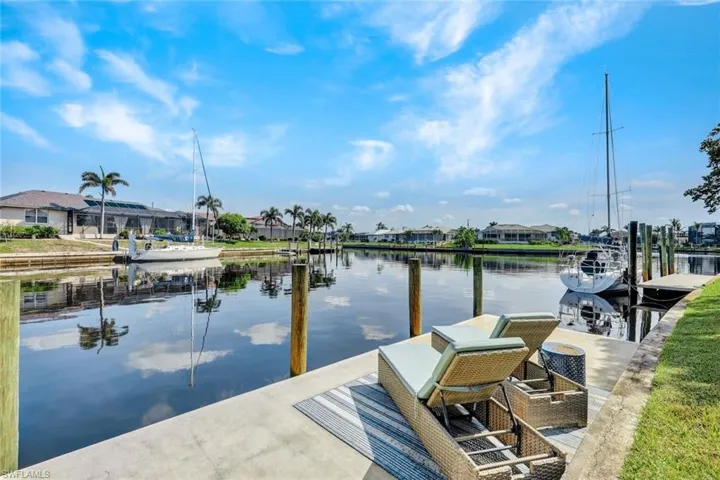 Dock with a water view and a residential view