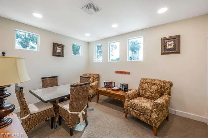 Carpeted dining room featuring a healthy amount of sunlight