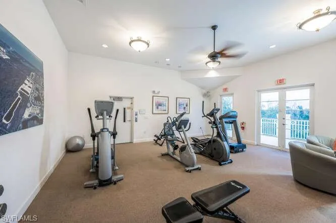 Gym with carpet flooring and ceiling fan
