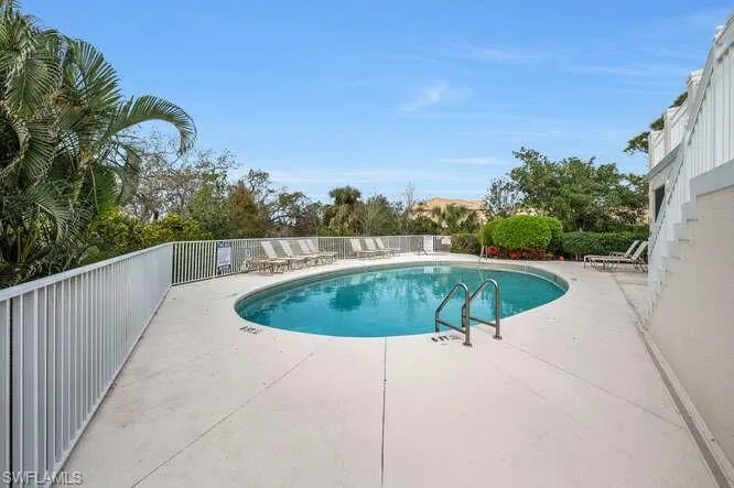 View of community pool with a patio