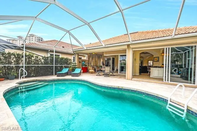 View of pool featuring a lanai and a patio