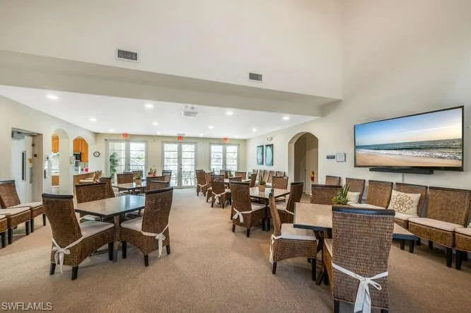 Dining area with light colored carpet
