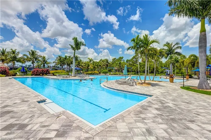 Community pool with a patio area
