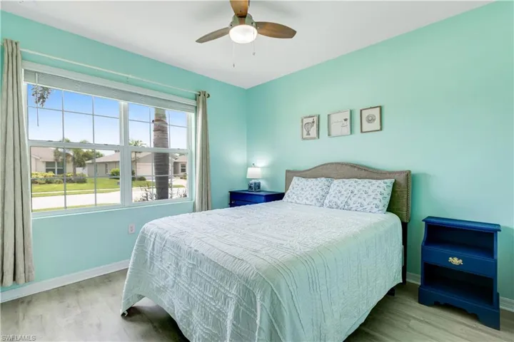 Bedroom featuring wood finished floors and a ceiling fan