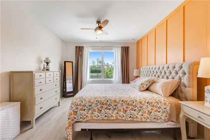 Bedroom featuring light wood-style flooring and a ceiling fan