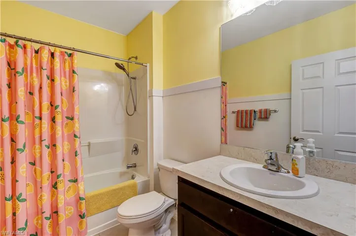 Bathroom with vanity and shower / bath combo