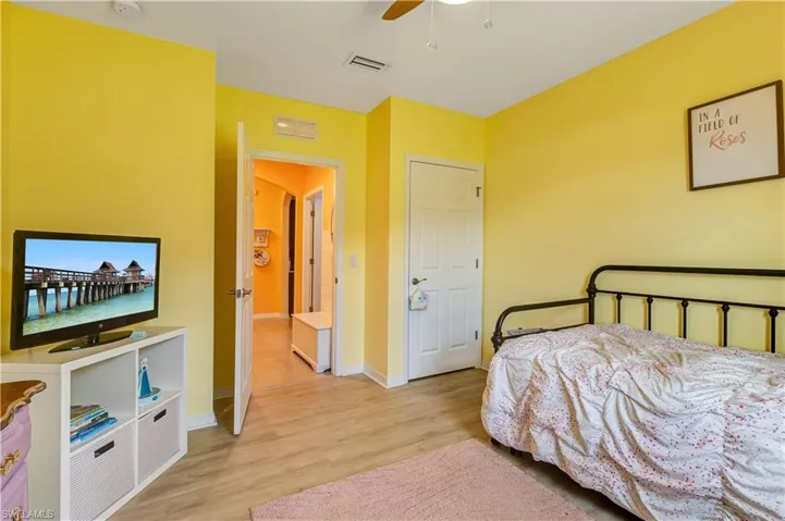 Bedroom featuring light wood-style floors and a ceiling fan