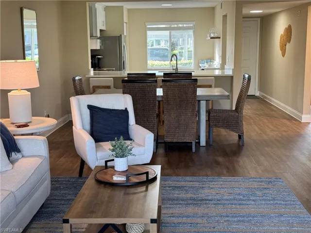 Living room featuring dark wood-type flooring