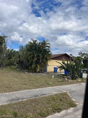 View of property hidden behind natural elements