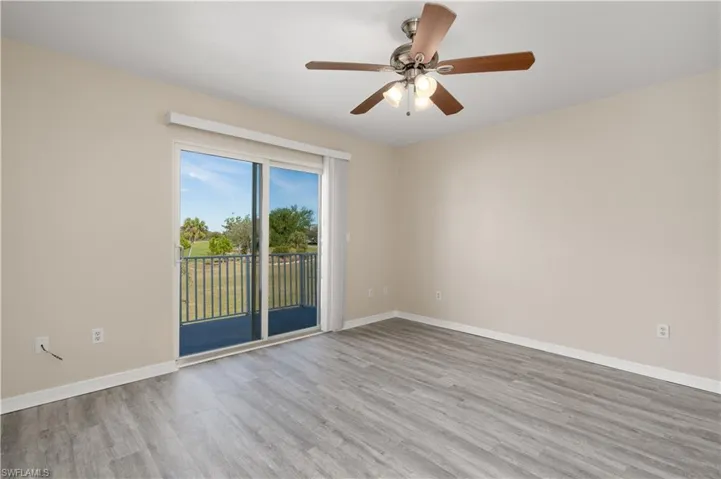 Unfurnished room featuring ceiling fan and light hardwood / wood-style floors