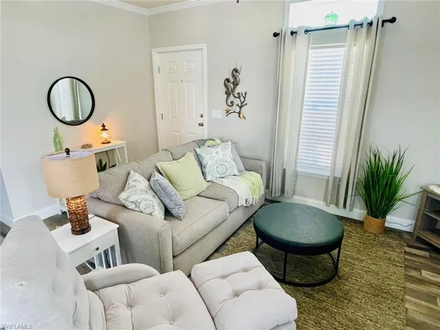 Living room featuring crown molding