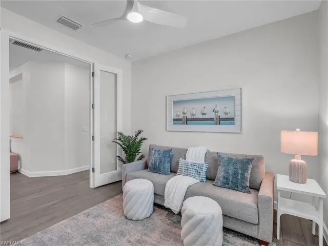 Versatile den with a closet, ideal for use as a fourth bedroom, home office, or flex space.