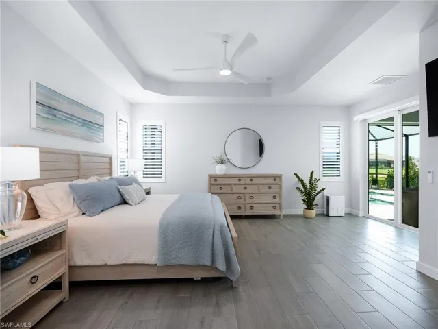 Spacious Primary Bedroom with sliding glass doors leading to the lanai