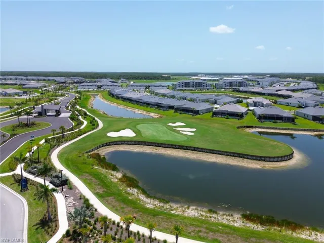 Expansive golf course and water features surrounded by residential properties