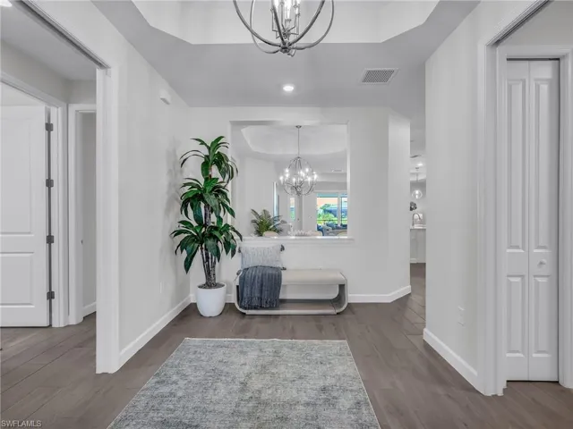 Welcoming foyer with a private guest wing to the left, complete with pocket doors for added privacy.