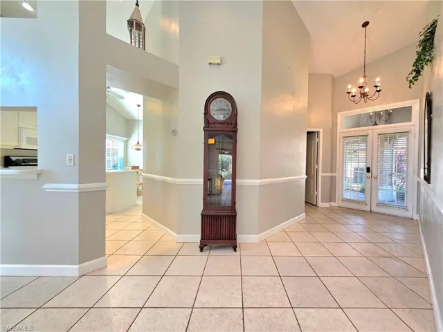 Entrance to property featuring french doors and stucco siding