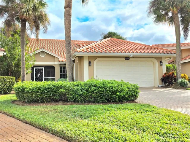 Back of property featuring glass enclosure, a yard, a sunroom, stucco siding, and ceiling fan
