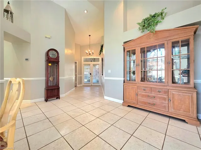 Hall with light tile patterned floors