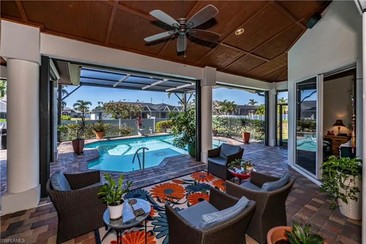 Great covered area around pool with custom ceiling details