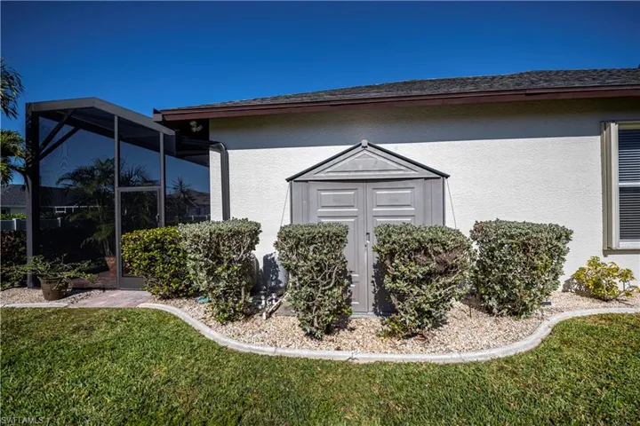 Storage shed on side of house