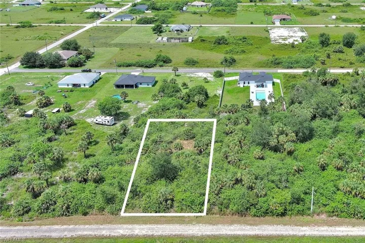 Aerial view of property's location featuring property parcel outlined