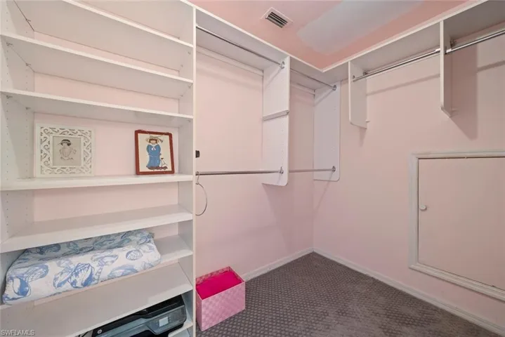 Walk in closet featuring carpet flooring and visible vents