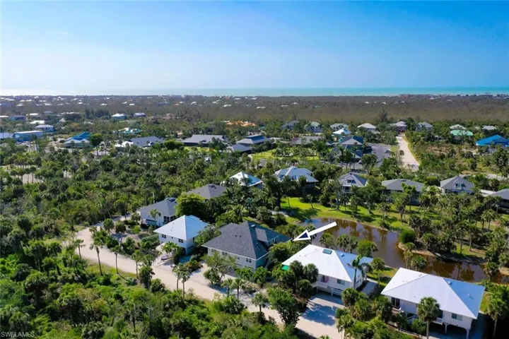 Aerial view featuring a residential view and a water view