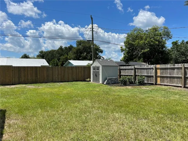 View of yard with a storage shed