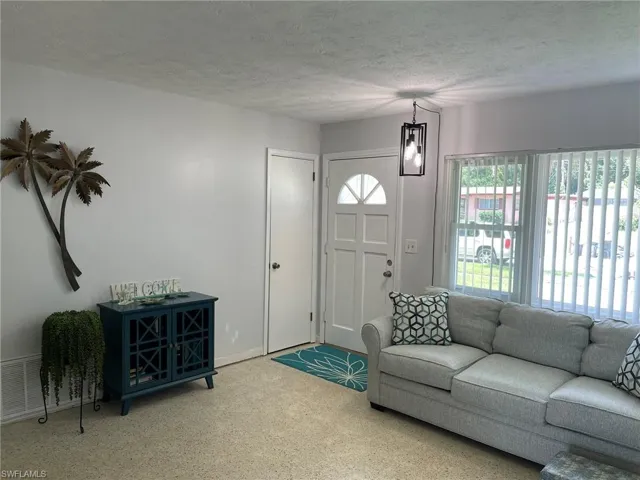 Living room featuring a textured ceiling