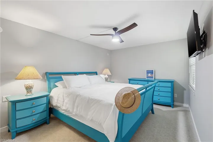Spacious bedroom with king size bed, 2 night stands, long dresser