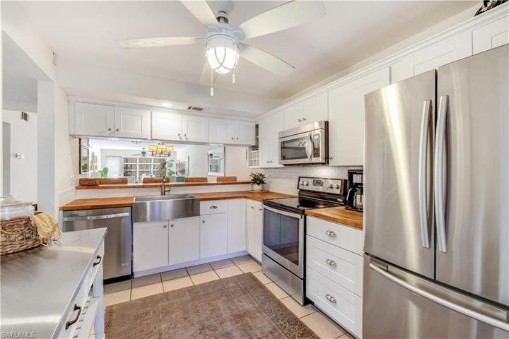Gourmet Chefs Kitchen with farmers sink, SS French refrigerator,butcher block