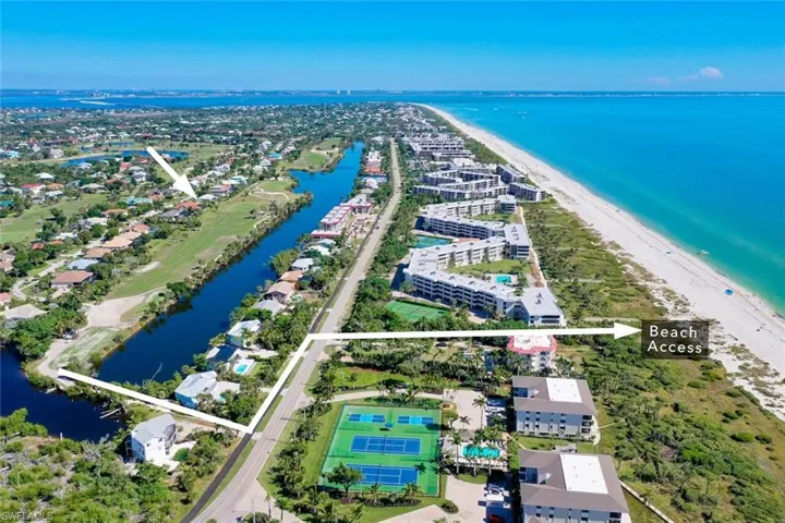 Aerial perspective of suburban area with expansive beach