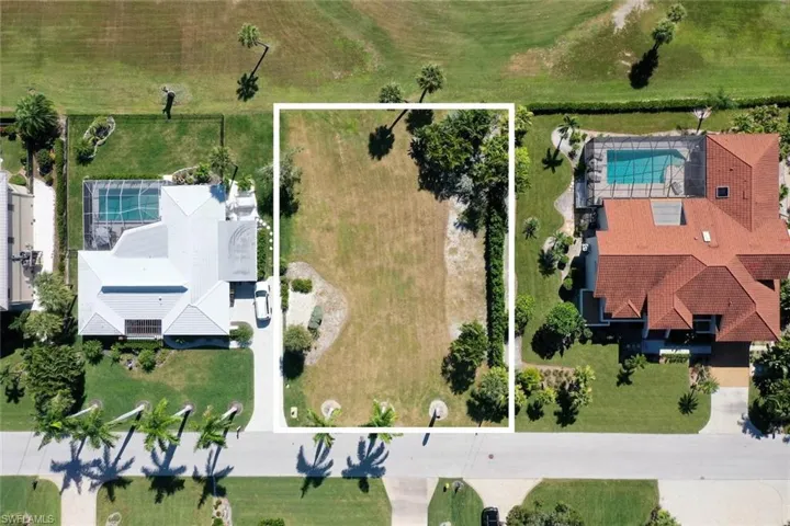 Aerial view of property's location with a pool and property boundaries highlighted